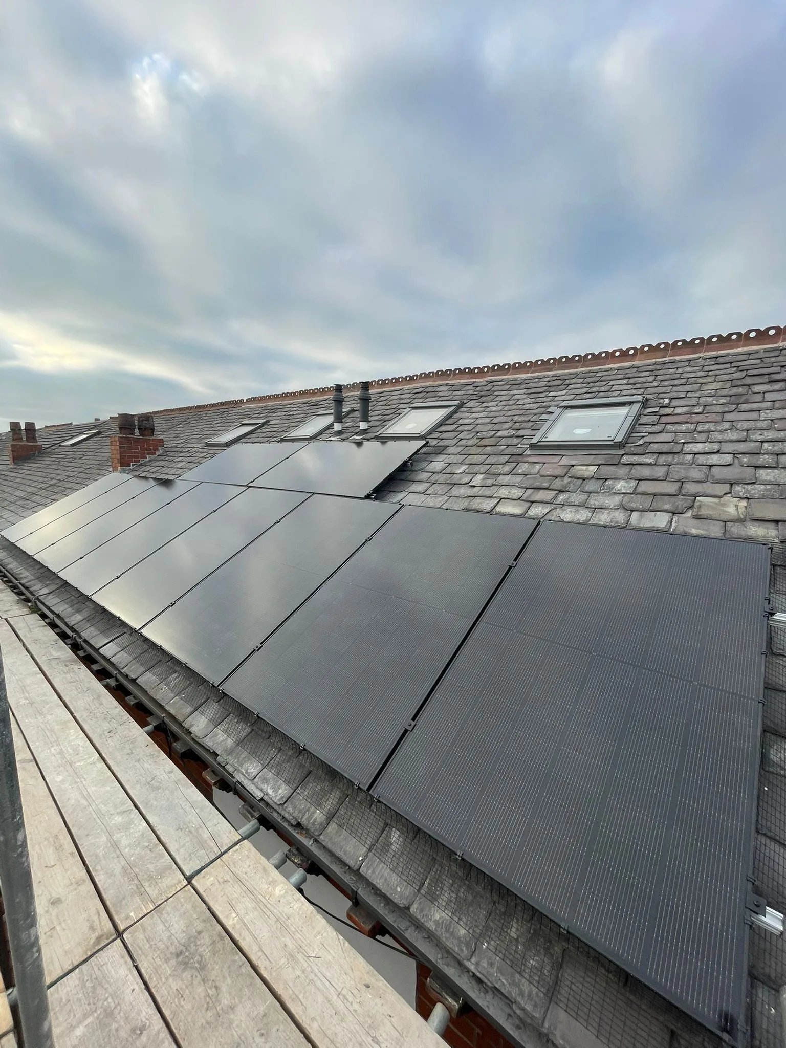 Solar panels on a home roof in Greater Manchester: 16 panels, 8 kWp