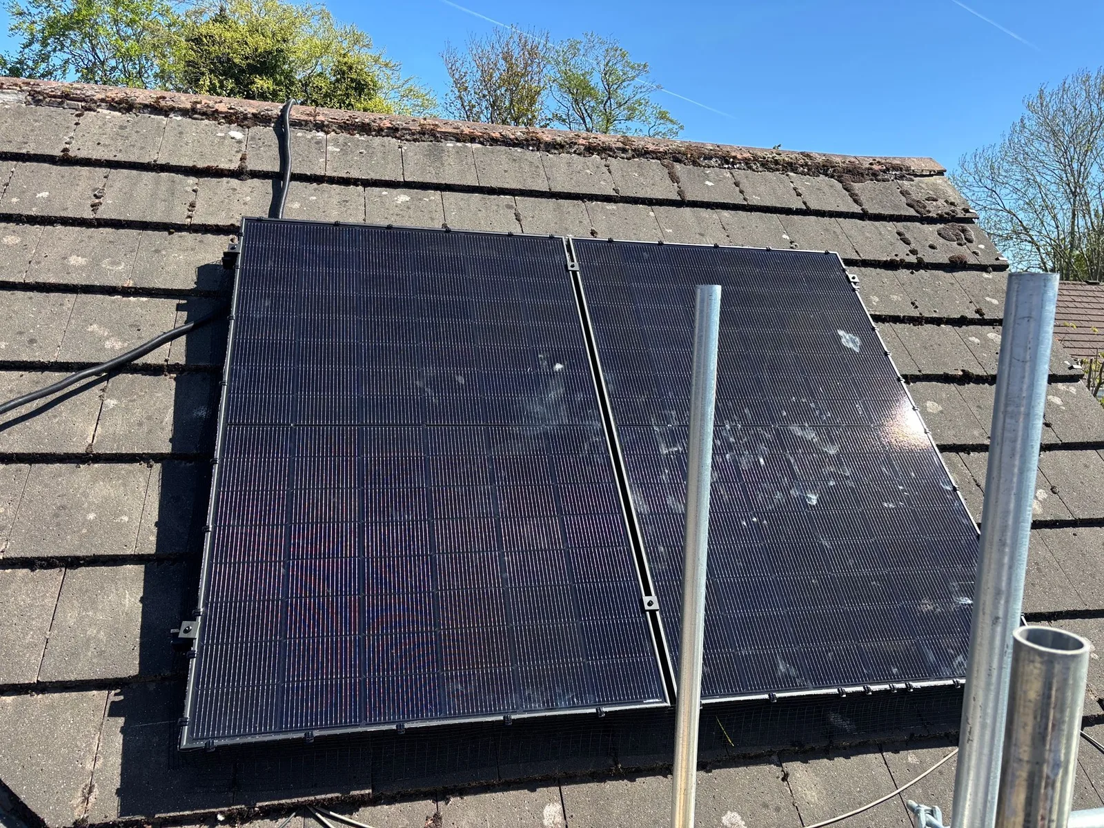 Solar panels on a home roof in Greater Manchester: 12 panels, 5.7 kWp